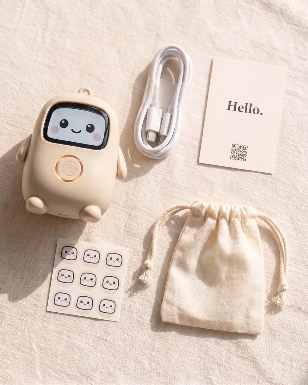 Lumi laid out on linen with a USB-C cable, a hello card, a sticker sheet and a cotton pouch