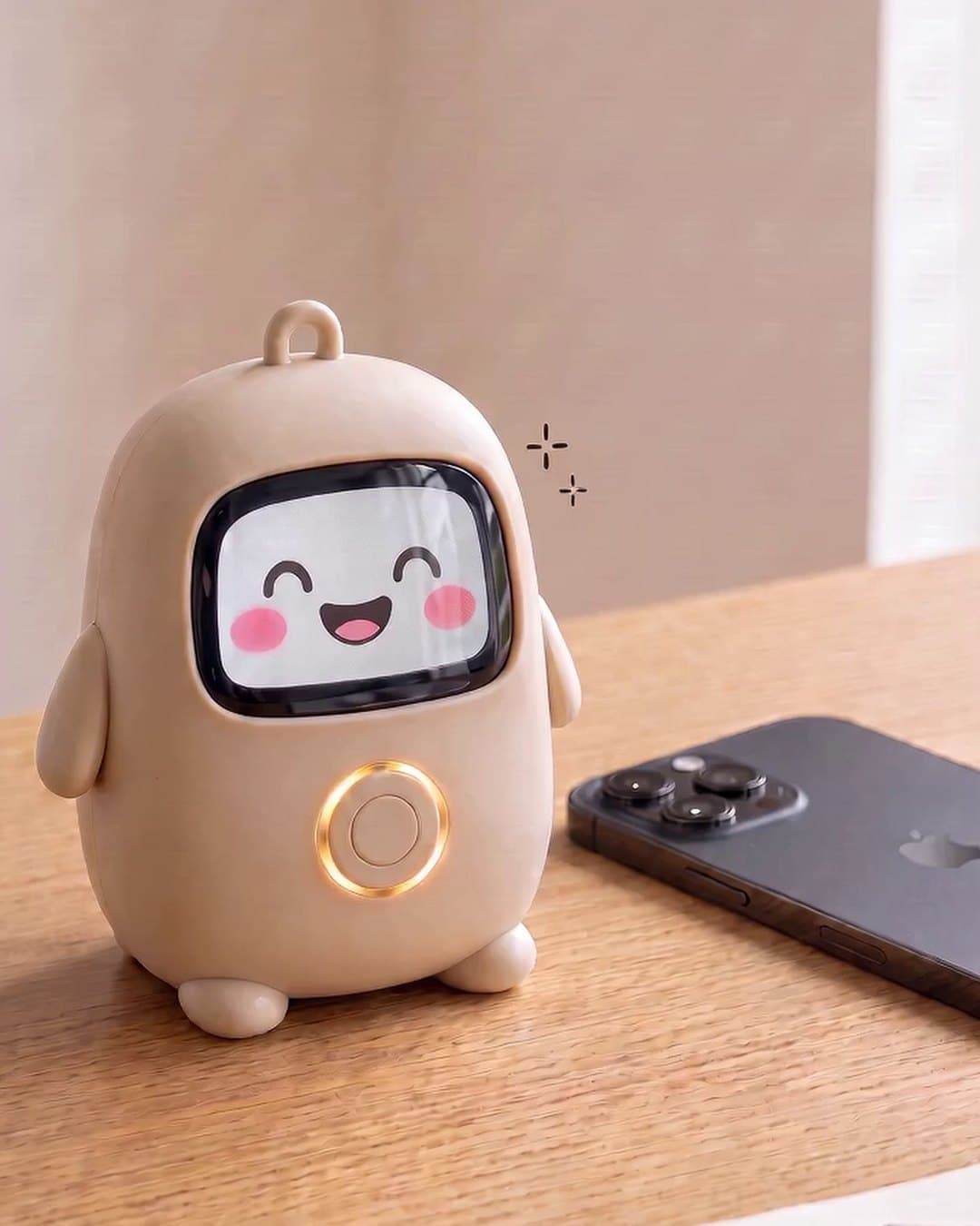 Lumi on a desk with its amber ring lit, an iPhone lying face down beside it