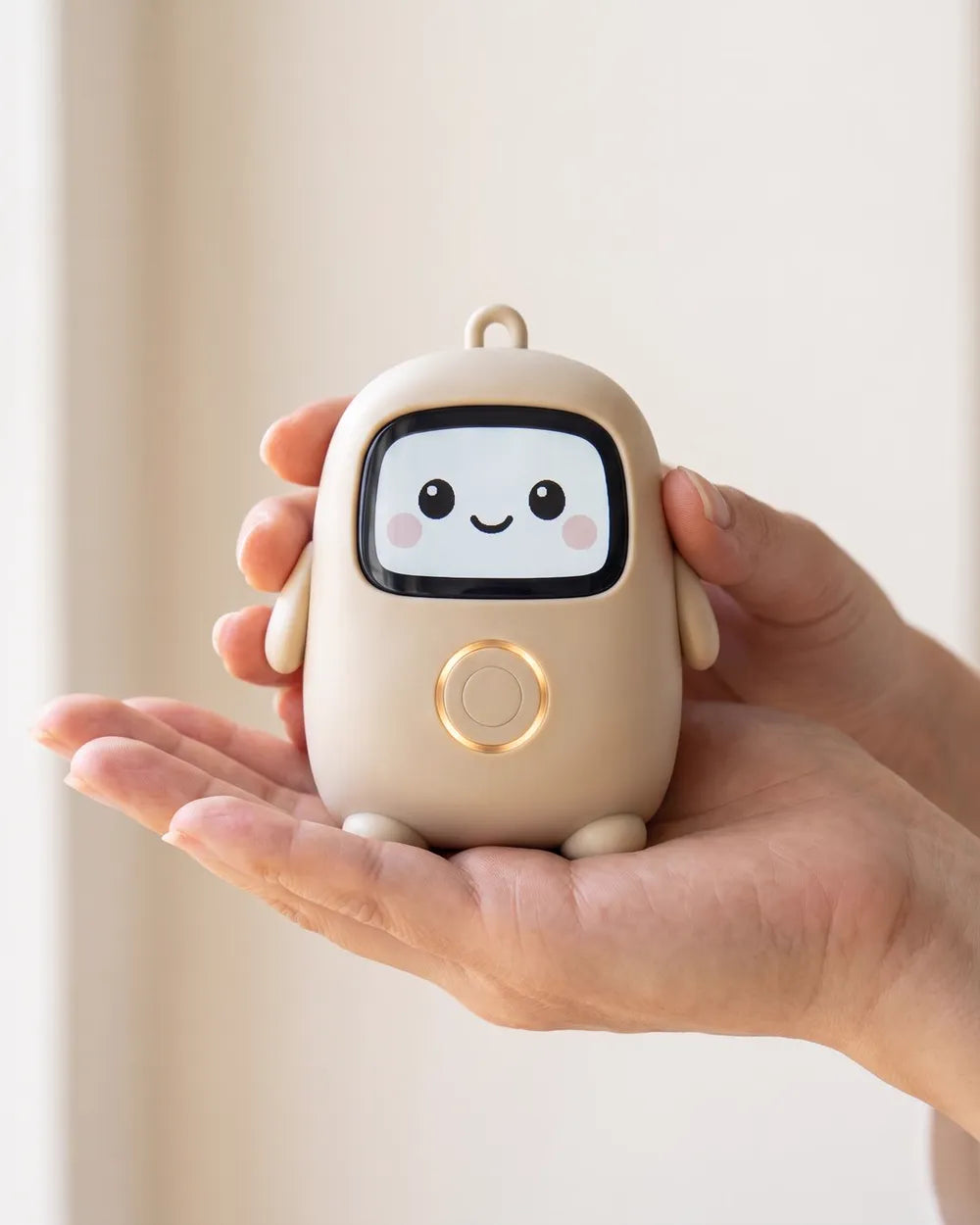 A hand holding Lumi, palm-sized, its screen face smiling