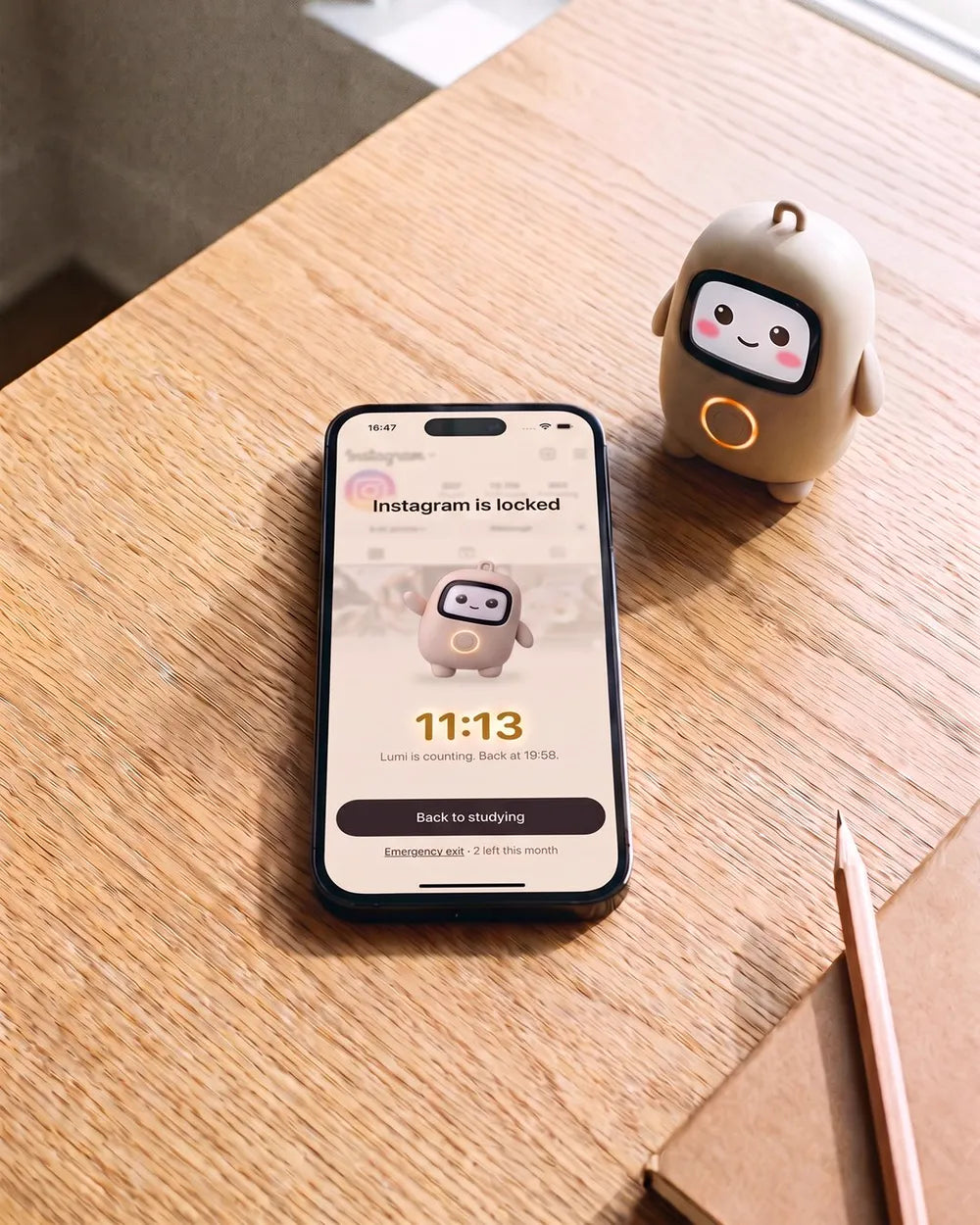A phone on a table showing Instagram locked with 11:13 to go, Lumi beside it